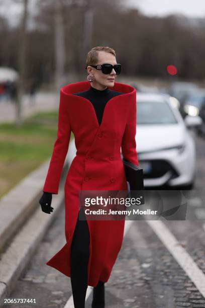 Renata Litvinova is seen wearing Balenciaga Outfit including black tights, black shades, black hand gloves, rose diamond earrings, a black top with...