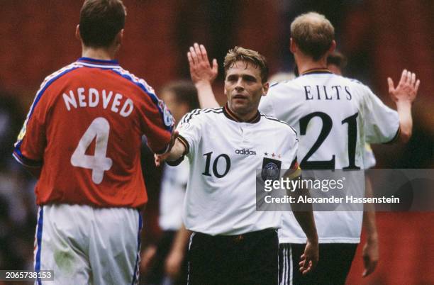 Czech footballer Pavel Nedved and German footballers Thomas Hassler and Dieter Eilts during the UEFA Euro 1996 Group C match between the Czech...