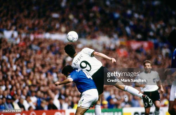 Italian footballer Amedeo Carboni pressures Slovenian-born German footballer Fredi Bobic during the UEFA Euro 1996 Group C match between Italy and...