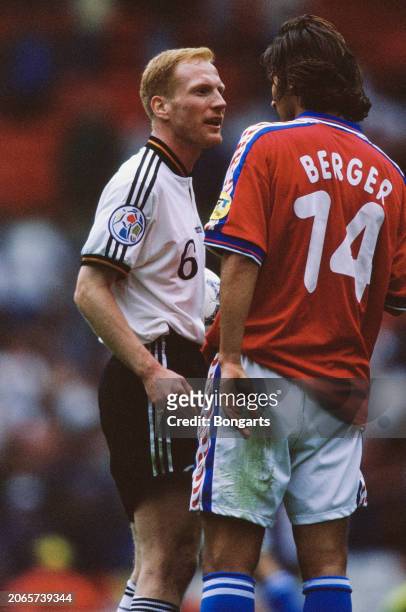 German footballer Matthias Sammer in conversation with Czech footballer Patrik Berger during the UEFA Euro 1996 final between the Czech Republic and...