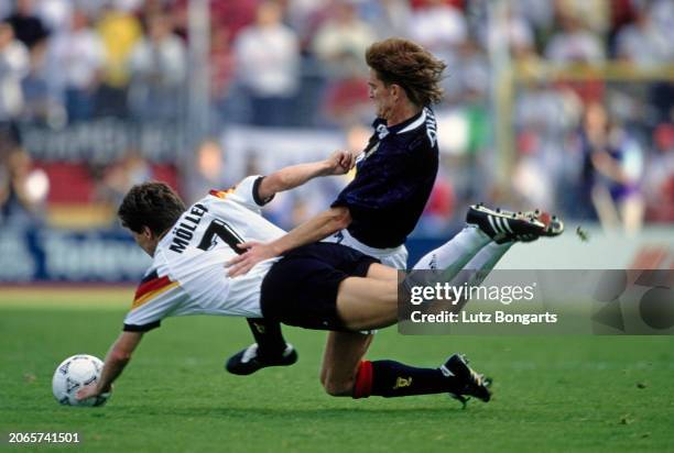German footballer Andreas Moller tackled by British footballer Richard Gough during the UEFA Euro 1992 Group 2 match between Scotland and Germany,...