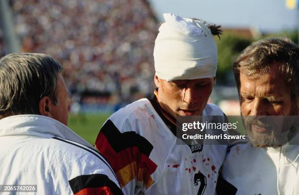 German footballer Guido Buchwald, his head bandaged after suffering an injury during the UEFA Euro 1992 Group 2 match between Scotland and Germany,...