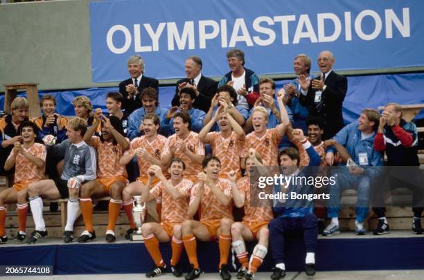 Dutch footballers and coaches celebrate after winning the UEFA Euro 1988 final between the Soviet Union and the Netherlands, held at Olympiastadion...