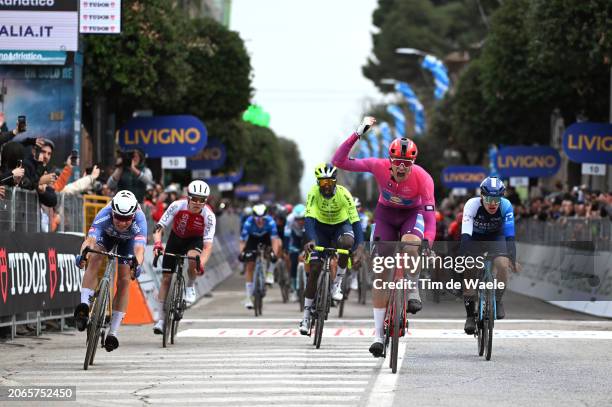 Jonathan Milan of Italy and Team Lidl-Trek - Purple Sprint Jersey celebrates at finish line as stage winner ahead of Jasper Philipsen of Belgium and...