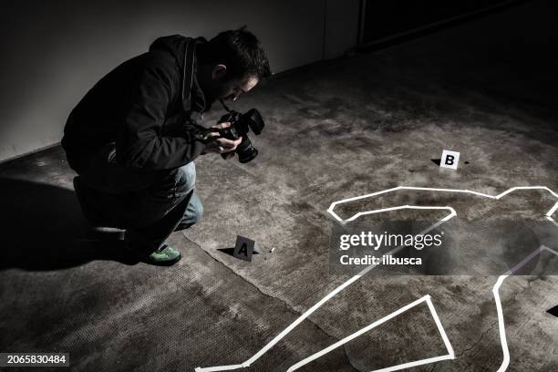 crime scene photographer - murder victim stock pictures, royalty-free photos & images