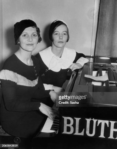 British musicians Peggy Cochrane and Anne McKenna sitting at a Blüthner piano, UK, 1932.