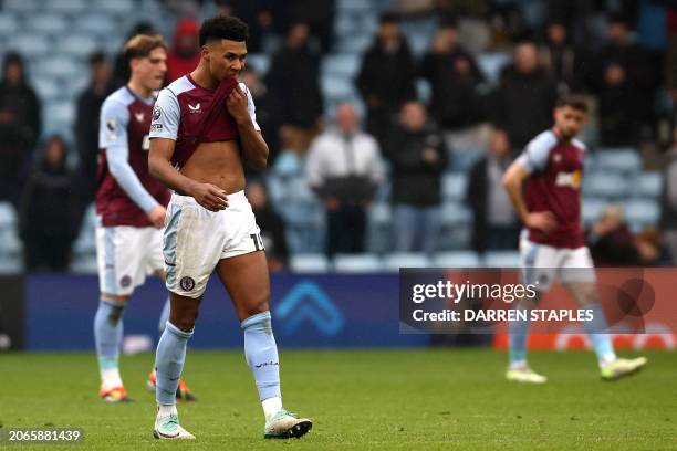 Aston Villa's English striker Ollie Watkins reacts after they conceded a fourth goal during the English Premier League football match between Aston...