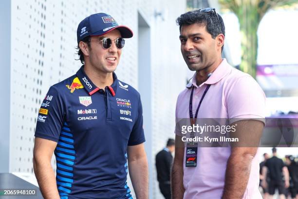 Sergio Perez of Mexico and Oracle Red Bull Racing chats with Karun Chandhok during practice ahead of the F1 Grand Prix of Saudi Arabia at Jeddah...