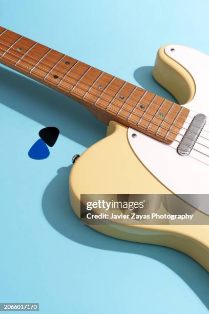 generic electric guitar on light blue background - country rock music stock pictures, royalty-free photos & images