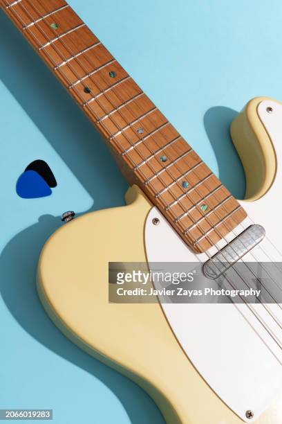generic electric guitar on light blue background - country rock music stock pictures, royalty-free photos & images