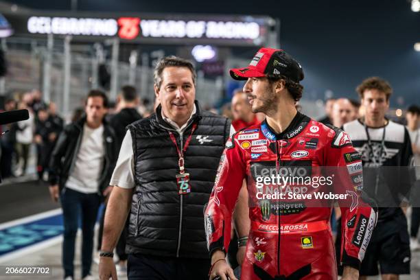 Dan Rossomondo and Francesco Bagnaia of Italy and Ducati Lenovo Team walking through the pitlane ahead of the MotoGP Qatar Airways Grand Prix of...