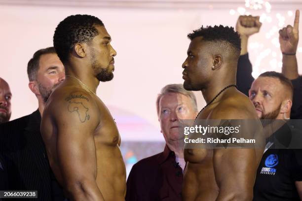 Anthony Joshua and Francis Ngannou face-off at the weigh-in ahead of their 'Knockout Chaos' heavyweight fight at Greece in Boulevard World on March...