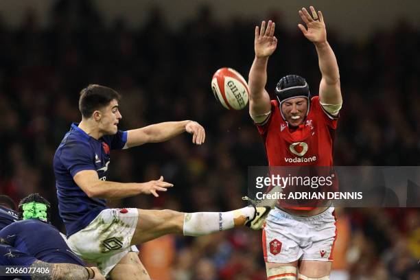 Wales' lock Adam Beard tries to charge down a kick from France's scrum-half Nolann Le Garrec during the Six Nations international rugby union match...