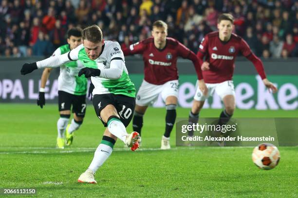 Alexis Mac Allister of Liverpool scores his team's first goal from a penalty kick during the UEFA Europa League 2023/24 round of 16 first leg match...