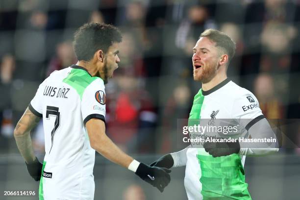 Alexis Mac Allister of Liverpool celebrates scoring his team's first goal from a penalty kick with teammate Luis Diaz during the UEFA Europa League...