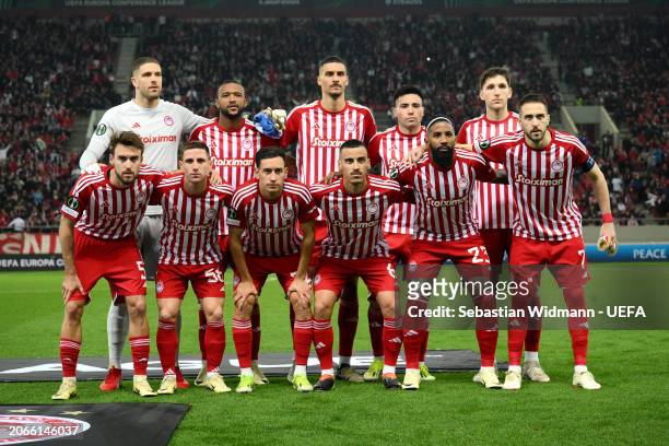Players of Olympiakos pose for a team photograph prior to the UEFA Europa Conference League 2023/24 round of 16 first leg match between Olympiacos FC...