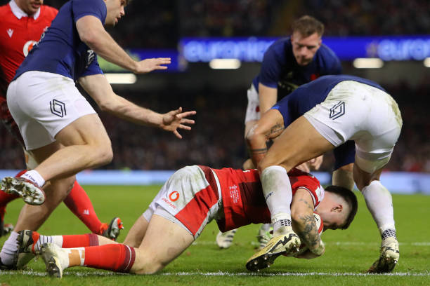 Wales' centre Joe Roberts touches the ball down to score their third try during the Six Nations international rugby union match between Wales and...