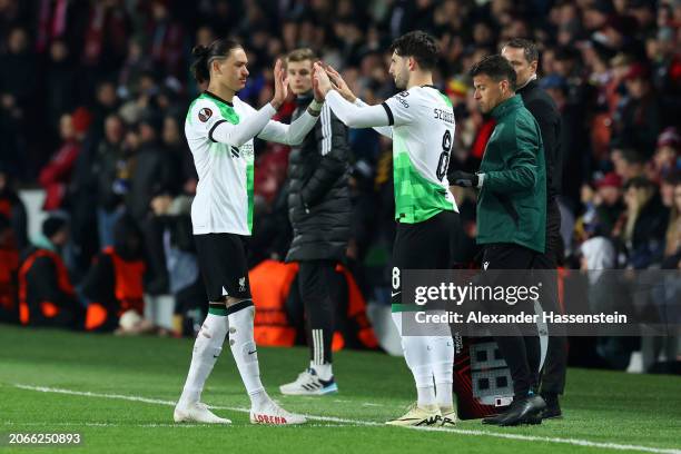 Darwin Nunez of Liverpool is substituted off for teammate Dominik Szoboszlai during the UEFA Europa League 2023/24 round of 16 first leg match...