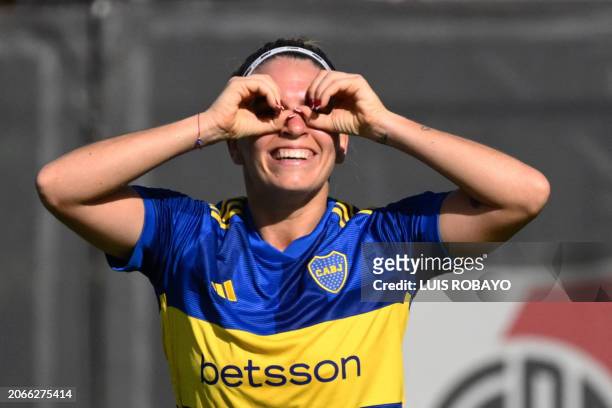 Boca Junior's midfielder Camila Gomez celebrates after scoring during the Argentine women's professional football championship between River Plate...