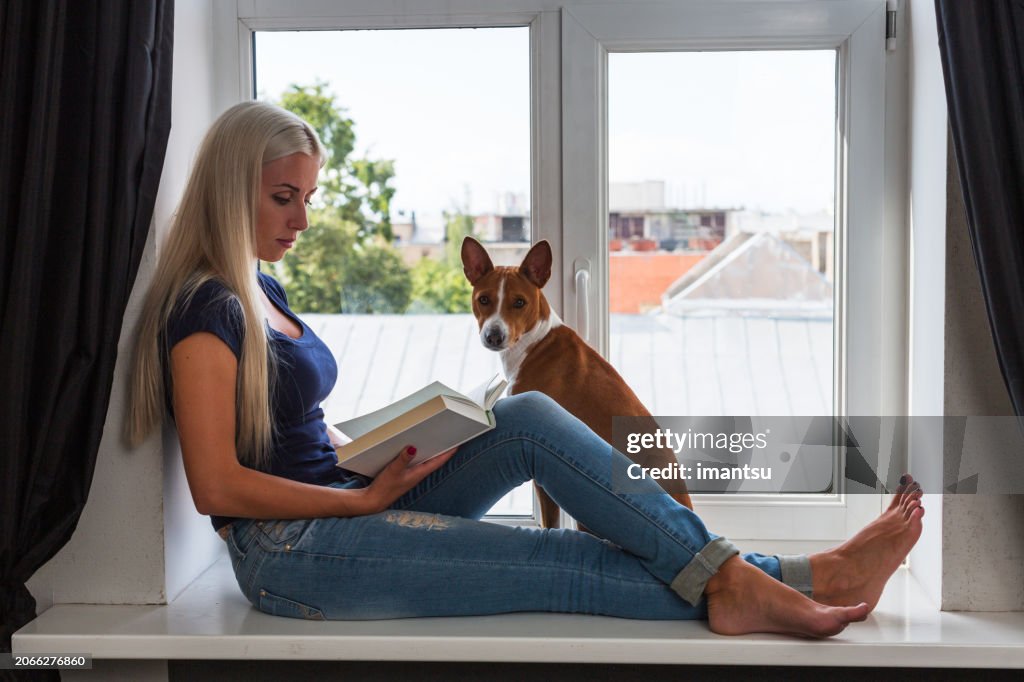 Young beautiful woman with a dog