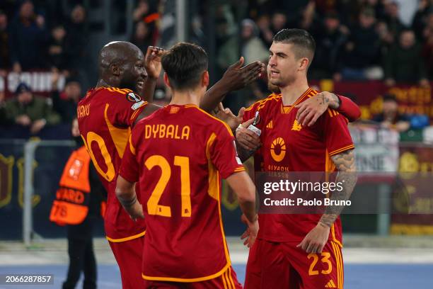 Gianluca Mancini of AS Roma celebrates with Romelu Lukaku and Paulo Dybala of AS Roma after scoring his team's third goal during the UEFA Europa...