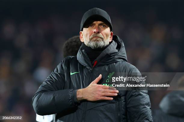 Jurgen Klopp, Manager of Liverpool, acknowledges the fans after the team's victory in the UEFA Europa League 2023/24 round of 16 first leg match...