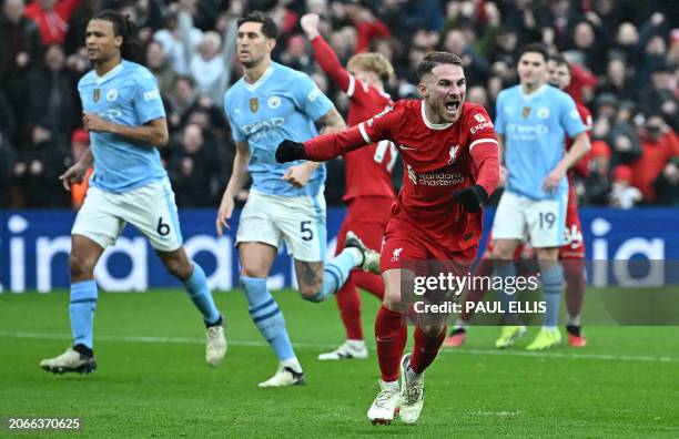 Liverpool's Argentinian midfielder Alexis Mac Allister celebrates after scoring the equalising goal from the penalty spot during the English Premier...