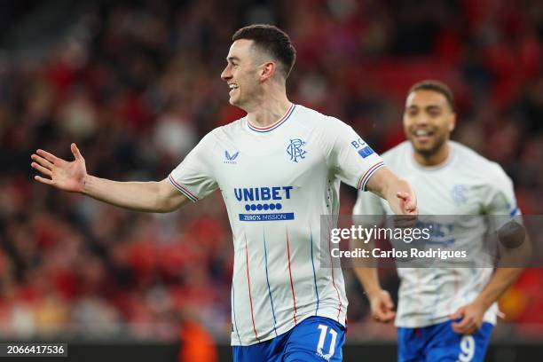 Tom Lawrence of Rangers celebrates scoring his team's first goal during the UEFA Europa League 2023/24 round of 16 first leg match between SL Benfica...