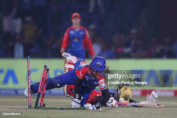 Taniyaa Bhatia of Delhi Capitals attempts to run out Shreyanka Patil of Royal Challengers Bangalore during the WIPL match between Delhi Capitals and...