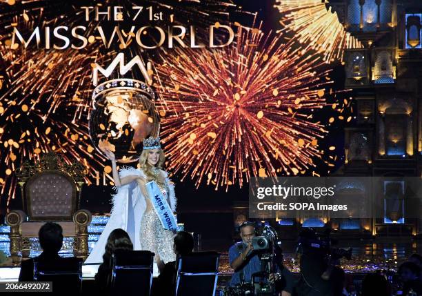 Czech Republic's Krystyna Pyszkova waves to the audience as she walks on the ramp after winning the 71st Miss World finals in Mumbai.