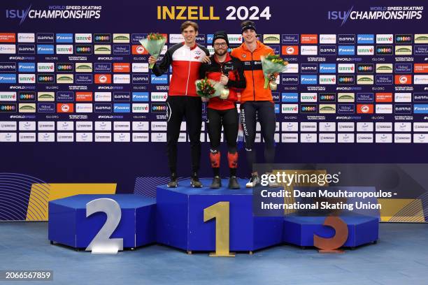 Marek Kania of Poland poses with the silver, Laurent Dubreuil of Canada with the gold and Jenning de Boo of Netherlands with the bronze after the...