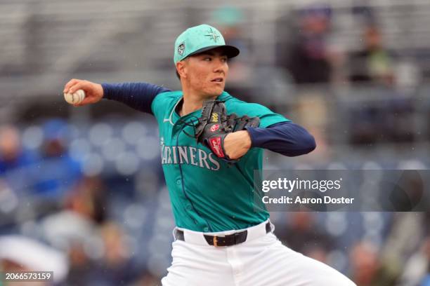 Bryan Woo of the Seattle Mariners throws in the first inning during a spring training game against the Los Angeles Angels at Peoria Sports Complex on...