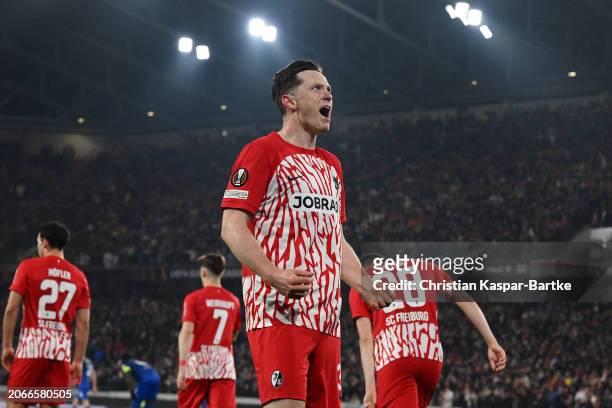 Michael Gregoritsch of SC Freiburg celebrates scoring his team's first goal during the UEFA Europa League 2023/24 round of 16 first leg match between...
