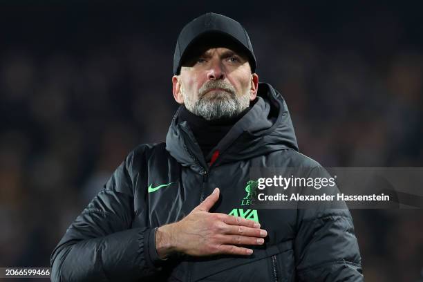 Juergen Klopp, Manager of Liverpool, acknowledges the fans after the team's victory in the UEFA Europa League 2023/24 round of 16 first leg match...