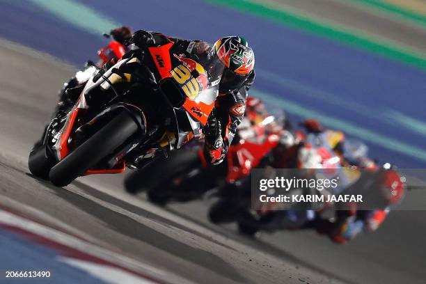 Red Bull KTM Factory Racing South African rider Brad Binder steers his bike during the Qatar MotoGP Grand Prix at the Lusail International Circuit in...