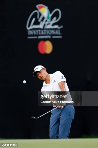 Collin Morikawa of the United States hits a chip shot on the 14th hole during the first round of the Arnold Palmer Invitational presented by...