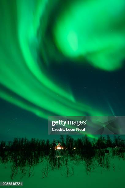 The Aurora Borealis, commonly known as the Northern Lights, are seen in the sky above Kiruna on March 7, 2024 in Kiruna, Sweden. The area is widely...