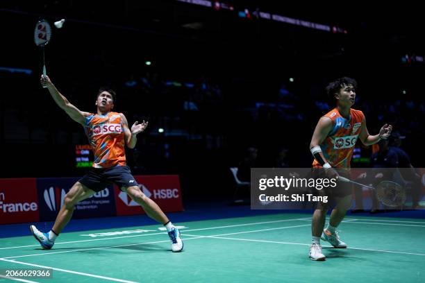 Supak Jomkoh and Kittinupong Kedren of Thailand compete in the Men's Doubles Second Round match against Liu Yuchen and Ou Xuanyi of China during day...