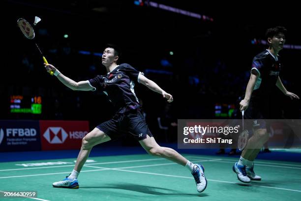 Liu Yuchen and Ou Xuanyi of China compete in the Men's Doubles Second Round match against Supak Jomkoh and Kittinupong Kedren of Thailand during day...