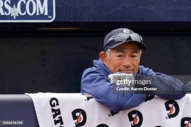 Ichiro Suzuki of the Seattle Mariners watches from the dugout in the second inning during a spring training game against the Los Angeles Angels at...