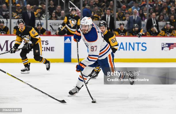 Edmonton Oilers center Connor McDavid shoots the puck during the first period in the NHL game between the Pittsburgh Penguins and the Edmonton Oilers...