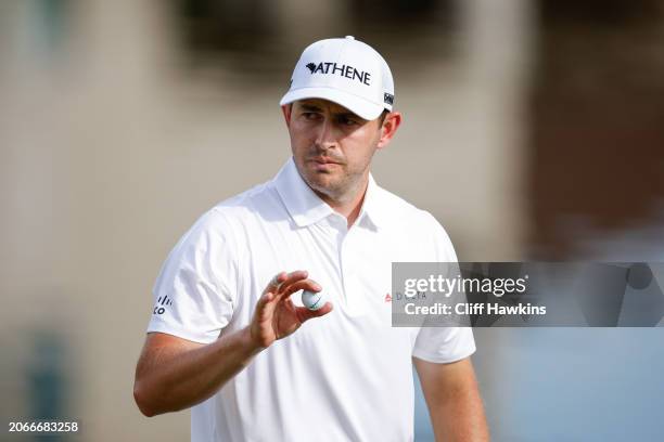 Patrick Cantlay waves to the crowd after making a putt on the 18th hole during the first round of the Arnold Palmer Invitational presented by...