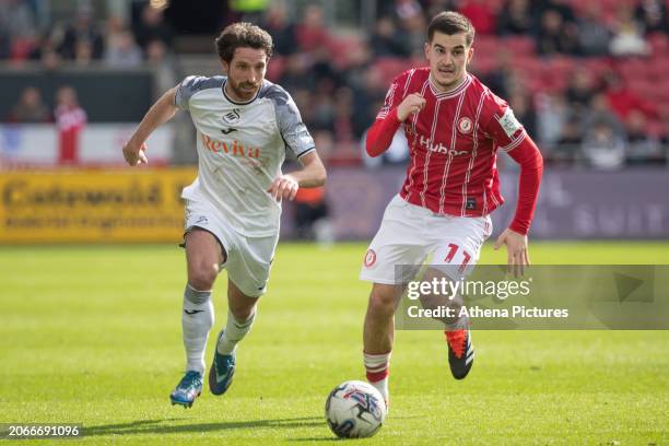 Joe Allen of Swansea City and Anis Mehmeti of Bristol City chase the ball during the Sky Bet Championship match between Bristol City and Swansea City...