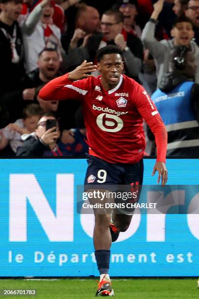 Lille's Canadian forward Jonathan David celebrates after scoring a goal during the French L1 football match between Lille and Le Havre at the Stade...