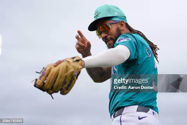 Crawford of the Seattle Mariners acknowledges fans before a spring training game against the Los Angeles Angels at Peoria Sports Complex on March 07,...