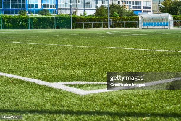 empty soccer field in a residential area of the city on a sunny summer day. - sports field fence stock pictures, royalty-free photos & images