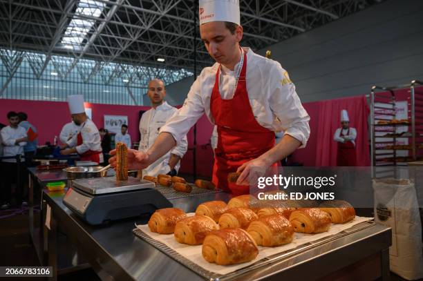 Winner Dimitri Bordon of France prepares a "pain au chocolat" also known as a "chocolatine" in south-west France, during the annual Coupe du Monde de...