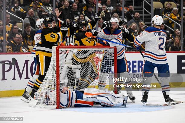 Pittsburgh Penguins right wing Bryan Rust and Edmonton Oilers defenseman Mattias Ekholm scrum after Edmonton Oilers goaltender Calvin Pickard goes...