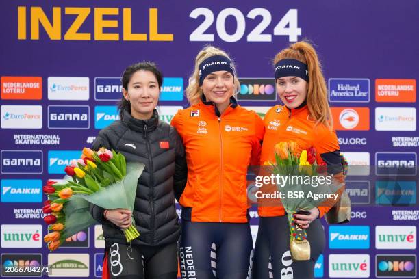 Mei Han of China, Joy Beune of The Netherlands, Antoinette Rijpma-De Jong of The Netherlands during the flower ceremony after competing on the...