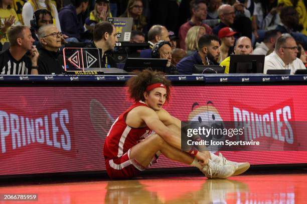 Nebraska Cornhuskers forward Josiah Allick watches the action on the court while waiting to enter the game during a Big Ten Conference college...